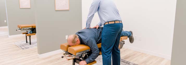 Chiropractor Springfield MO Tyler Alsup Adjusting Back