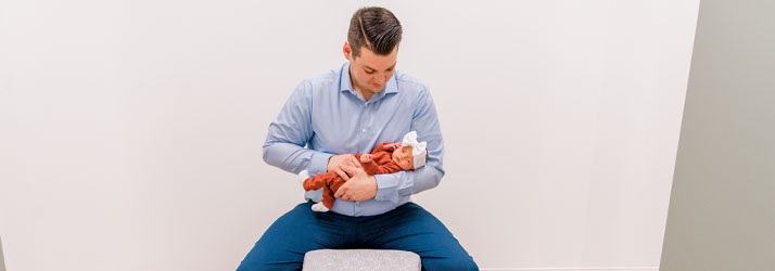 Chiropractor Springfield MO Tyler Alsup Adjusting Infant Chiropractor Springfield MO Tyler Alsup Adjusting Infant